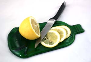 recycled gordons gin  bottle lemon board